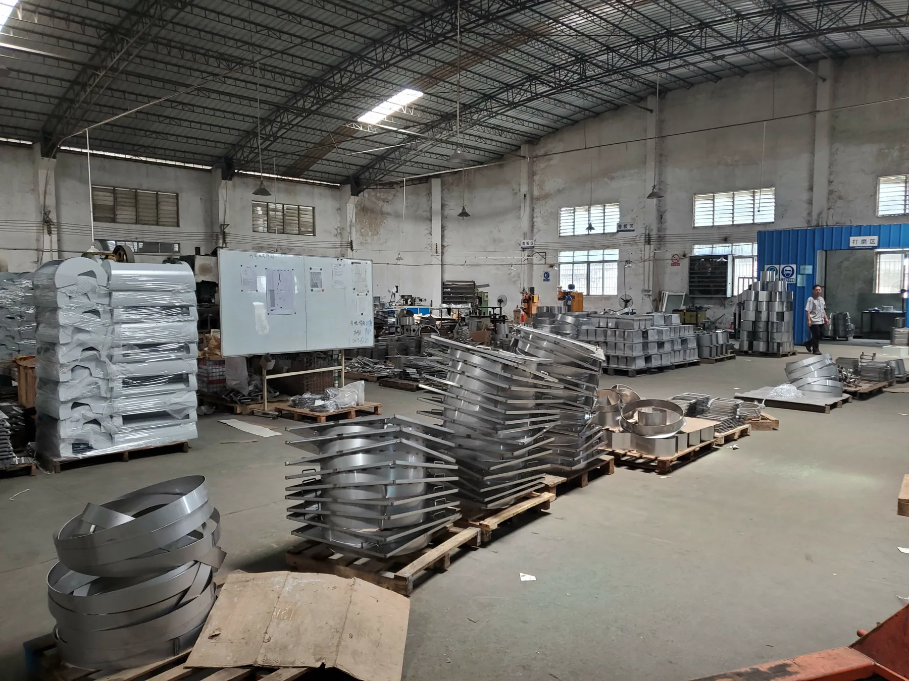 Sheet-metal production floor with formed components ready for assembly